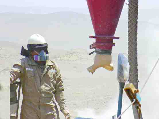 A driller operates a reverse-circulation drill at the Magnetite Manto deposit, roughly 1 km from Mina Justa in southwestern Peru. Chariot Resources plans to use higher-grade oxide ore from Magnetite Manto as a starter pit for the mine, which is scheduled to go into production in 2010.