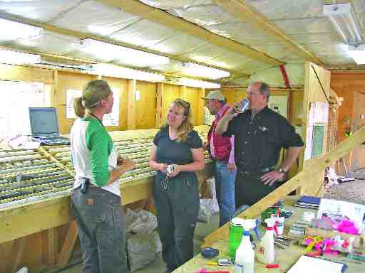 BY GWEN PRESTONNorthern Freegold Resources vice-president Susan Craig and president Bill Harris with a project geologist in the Nucleus/Revenue core shed at the Freegold Mountain project, in the Yukon.