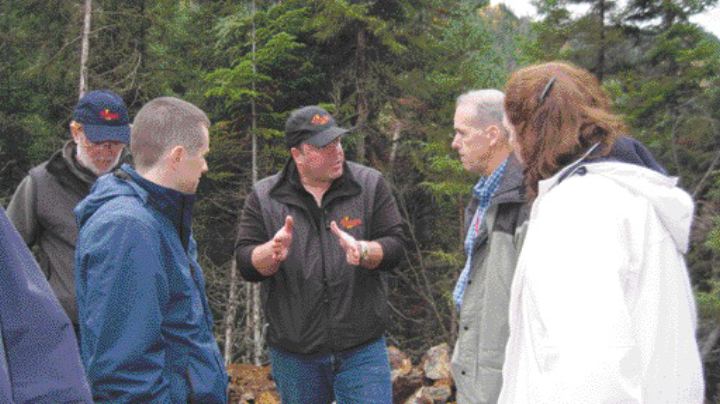 BY VIRGINIA HEFFERNANThreegold Resources president Antoine Fournier explains the structural geology of the Dome Lemieux project to visitors.