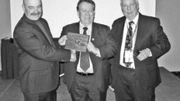 RUBICON MINERALSOPA president Wally Rainer, centre, and Michael Gravelle (right), Minister of Northern Development and Mines Ontario present the award to Perry English, Left