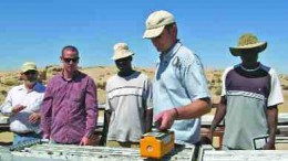 BY SUSAN KIRWINKeith Webb, senior geologist for Extract Resources, uses a spectrometer to show the U3O8 levels in drill core from the Ida Dome area of the company's Husab uranium project in Namibia.