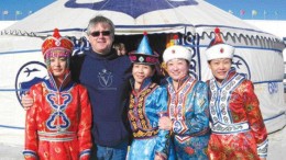 BY TRISH SAYWELLRoger Walsh, Jinshan Gold Mines' VP of corporate development, with staff in traditional finery to welcome guests.