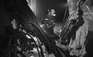 Working a long drill at the 777 copper-zinc mine in Flin Flon, Manitoba.