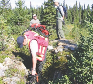 Aurora Energy's chief geoscientist Rick Valenta uses a scintillometer to test for uranium mineralization in trenches on the Michelin deposit in Labrador's Central Mineral Belt.