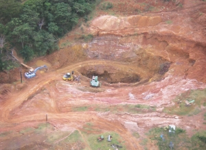 LATIN AMERICAN MINERALS Top: Working at the Minas Guaira pit, at Latin American Minerals' Paso Yobai gold project in Paraguay. Inset: Gold found on surface veins in Paso Yobai.