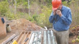 Geologist Marcus Waring inspects core samples at Luna Gold's Aurizona gold project in Brazil.