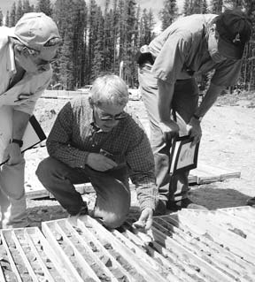 Examining core at Kwanika.