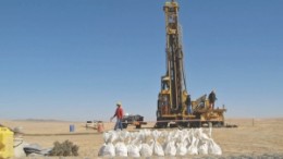 Samples are collected in front of a drill at Bannerman Resources' Goanikontes project in Namibia. The company has announced plans to begin trading on the country's nascent stock exchange this month.