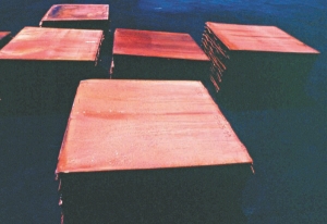 Stacked copper sheets awaiting shipment from Codelco's Chilean operations.