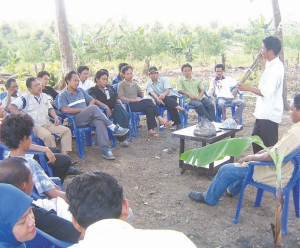 Rubber farmers in Indonesia receive training from a local university as part of participatory development planning.