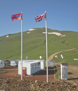 The flags of Armenia and the United Kingdom fly side by side at Lydian International's Amulsar gold project, in Armenia. The company's "first mover" strategy has also taken it to Kosovo, once one of Europe's largest zinc-producing areas.