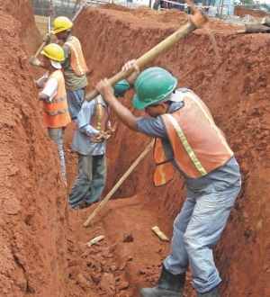 Workers dig out the foundation for the mill at Infinito Gold's Crucitas gold mine, in Costa Rica. The site will host a conventional carbon-in-leach plant that is expected to yield 96% gold recovery from near-surface saprolite and 92% recovery from the deeper hard rock.