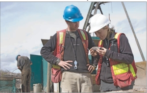 IMPERIAL METALS Geologists Lee Ferreira (left) and Melissa Darney examine core drilled at Imperial Metals' Mount Polley open-pit copper-gold mine, in central British Columbia.