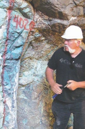 Tom Henricksen, Apoquindo Minerals' chief geologist, inspects clear signs of copper mineralization at Elenita.