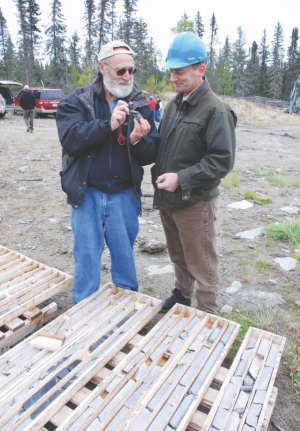 Golden Band Resources chairman Ron Netolitzky (left) and president and CEO Rodney Orr examine drill core from the company's Bingo gold deposit in north-central Saskatchewan.