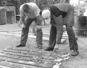 Brian MacEachen (left), Linear Metals' president, and Matt Rees, chief geologist, examine drill core from the KM61 copper-moly-silver project in northwestern Ontario.