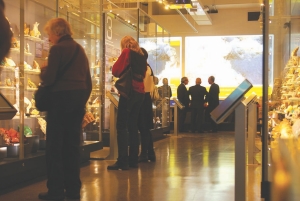 BY ANDREW SEALE Clockwise from the top: Visitors to the Royal Ontario Museum browse the displays in the Vale Inco Limited Gallery of Minerals; the hair-speckled Millerite; Repose; Pigeon Blood Red; a tourmaline display in the Light & Stone exhibit.