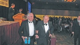 Canadian Mining Hall of Fame inductee Prof. Donald "Digger" Gorman (right) is escorted from the podium by Jeff Fawcett, professor emeritus in the department of geology at the University of Toronto.