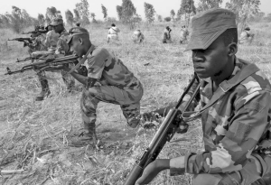 Nigerois soldiers from the 322nd Parachute Regiment practise field tactics during combat training facilitated by U. S. Army soldiers in 2007. The volatile country, which has been plagued with unrest, holds one of the world's best uranium resources.