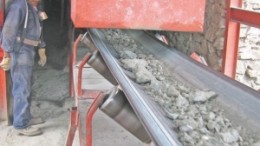 A conveyor wisks feed from the grizzly to the grinder at Impact Silver's Zacualapan silver-lead-zinc mine in Mexico.