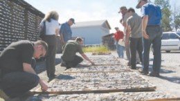 Visitors peruse core samples at Alexandria Minerals' 100%-owned Orenada property, in Val d'Or, Que.