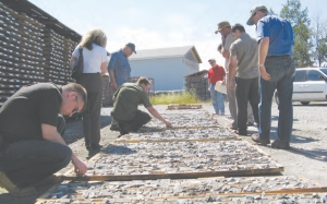 Visitors peruse core samples at Alexandria Minerals' 100%-owned Orenada property, in Val d'Or, Que.