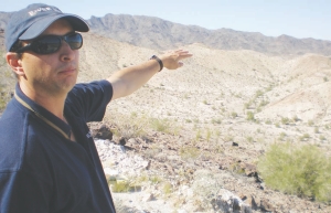 John-Mark Staude, Riverside Resources' president and CEO, surveys the lay of the land at his company's SugarLoaf Peak gold project in Arizona.