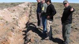 Visitors examine a trench at Argentex Minings Pinguino project in Argentina, led by Argentex president and CEO Ken Hicks (right) and chief geological consultant Diego Guido (second from right).
