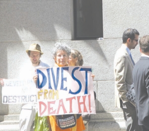 Protestors organize outside a hotel in downtown Toronto while Goldcorp holds its annual shareholder meeting.