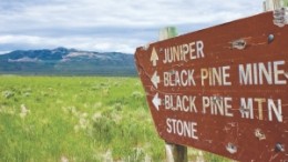 An old sign in southeast Idaho points to what is now Western Pacific Resources' Mineral Gulch gold project, seen in the distance.