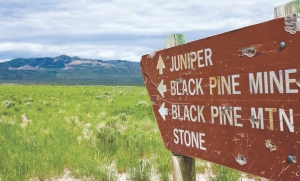 An old sign in southeast Idaho points to what is now Western Pacific Resources' Mineral Gulch gold project, seen in the distance.