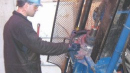 A worker operates a drill at Alto Ventures' Coldstream gold project in Ontario.