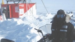 Geologist Nicole Lasanen stands in front of a drill on hole 21 at the Llama Lake Zone at Sabina Gold & Silver's Back River project in southwest Nunavut.