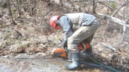 A worker cuts out a channel sample from the Kipawa deposit at Matamec Exploration's Zeus REE project in Quebec.