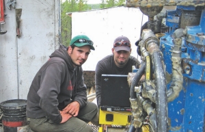 Geologists Clark Gamelin (left) and Chad Sorba doing downhole radiometric probing on the Zone C discovery hole at Denison Mines' Wheeler River uranium project in northern Saskatchewan.