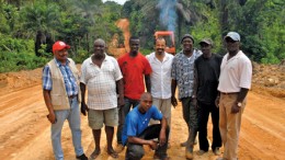 Taia Actor and Taia CEO Jeffrey Wright (standing, fourth from left) visiting the 29-km, donor-funded Taia Peace Foundation road-rehabilitation project in Sierra Leone.