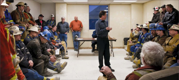 San Gold president and CEO George Pirie (centre) talks to miners at the Rice Lake gold mine, about 230 km northeast of Winnipeg, Man. Photo by San Gold