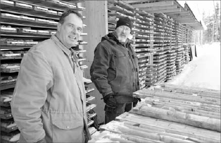 From left, VMS Ventures' advisory board member Alan Bailes and vice-president of exploration Mark Fedikow at the Reed Lake polymetallic project's core shack. Photo by VMS Ventures