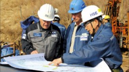 Studying a map at Woulfe Mining's Sangdong tungsten-molybdenum project in South Korea, from left: Bill Kable, vice-president technical; Arne Rahnel, manager of projects; and Wang In Jeon, safety manager. Photo by Woulfe Mining