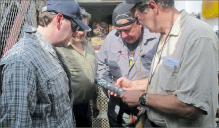 Examining core at Pacific North West Capital's River Valley PGM project in Sudbury, Ontario. From left: vice-president of exploration Ali Hassanalizadeh, project geologist Richard Zemoroz and technical advisers John Londry and Gordon Trimble. Photo by Pacific North West Capital