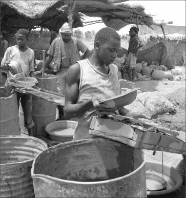 Current-day artisanal miners at Riverstone Resources' Karma gold project in Burkina Faso. Photo by The Northern Miner