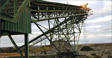 A conveyor discharging ore onto a stockpile at Caledonia Mining's Blanket gold mine in southwest Zimbabwe. Photo by Caledonia Mining