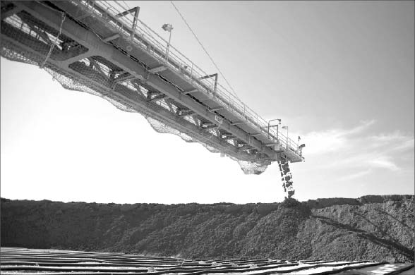 A conveyor piles material at BHP Billiton and Rio Tinto's Escondida copper mine in Antofagasta Province, Chile. Photo by BHP Billiton