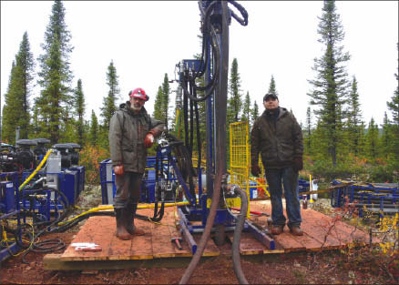 Cap-Ex Ventures Driller Carol Harvey (left) and helper Matieu Sunny at Cap-Ex Ventures' Block 103 iron ore project, 30 km northwest of Schefferville, Quebec.