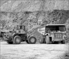 Machine operators move material at Yamana Gold's Gualcamayo gold mine in Argentina. Photo by Yamana Gold