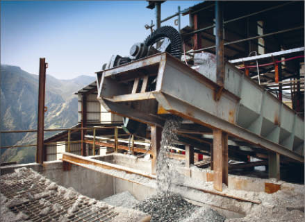 A conveyor moves material at Malaga's Pasto Bueno tungsten mine in Peru. Photo by Grard Tournebize