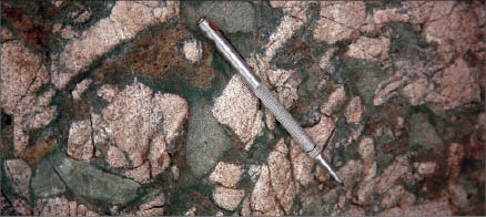 An outcrop of diorite breccia with a chlorite matrix at Trelawney Mining and Exploration's Chester gold project in northern Ontario. Photo by Trelawney Mining and Exploration