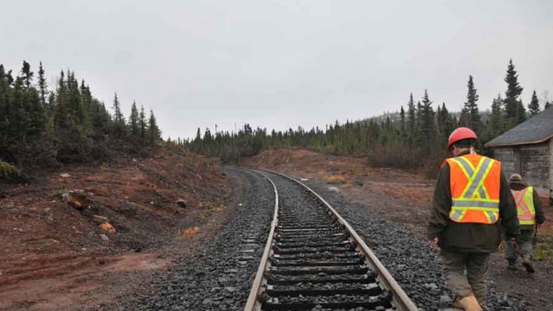 Workers walk beside a railroad at Labrador Iron Mines' Schefferville project in the Labrador Trough. Photo by Labrador Iron Mines