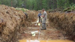 Taranis Resources' vice-president of exploration Jim Helgeson (background) and technician Thomas Gardiner sampling and mapping a trench at the Naakenavaara copper-gold project in northern Finland. Source: Taranis Resources