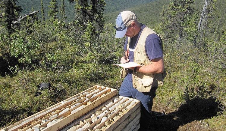 A worker taking notes at Kaminak Gold's Coffee property. Source: Kaminak Gold